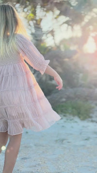 Video of girl wearing Indie Blue Girls Karina Dress in Soft Pink Chiffon on the beach