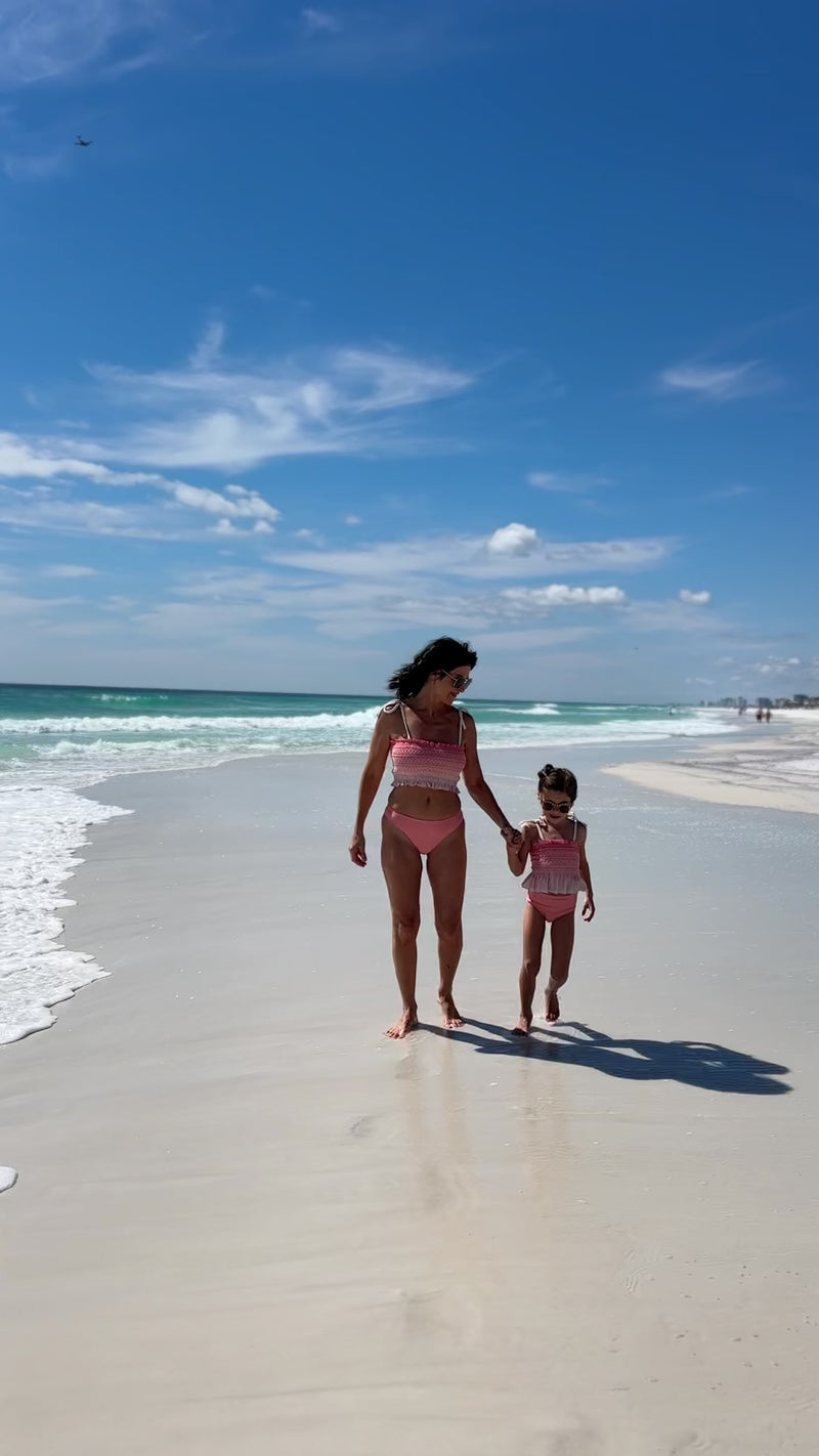 Video of Mom and Daughter wearing matching Indie Blue Smocked Tankini Set in Sunrise Ombre on the beach